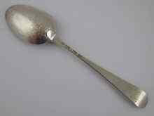 Appraisal: A Georgian silver Hanoverian scrollback tablespoon by William Sumner and