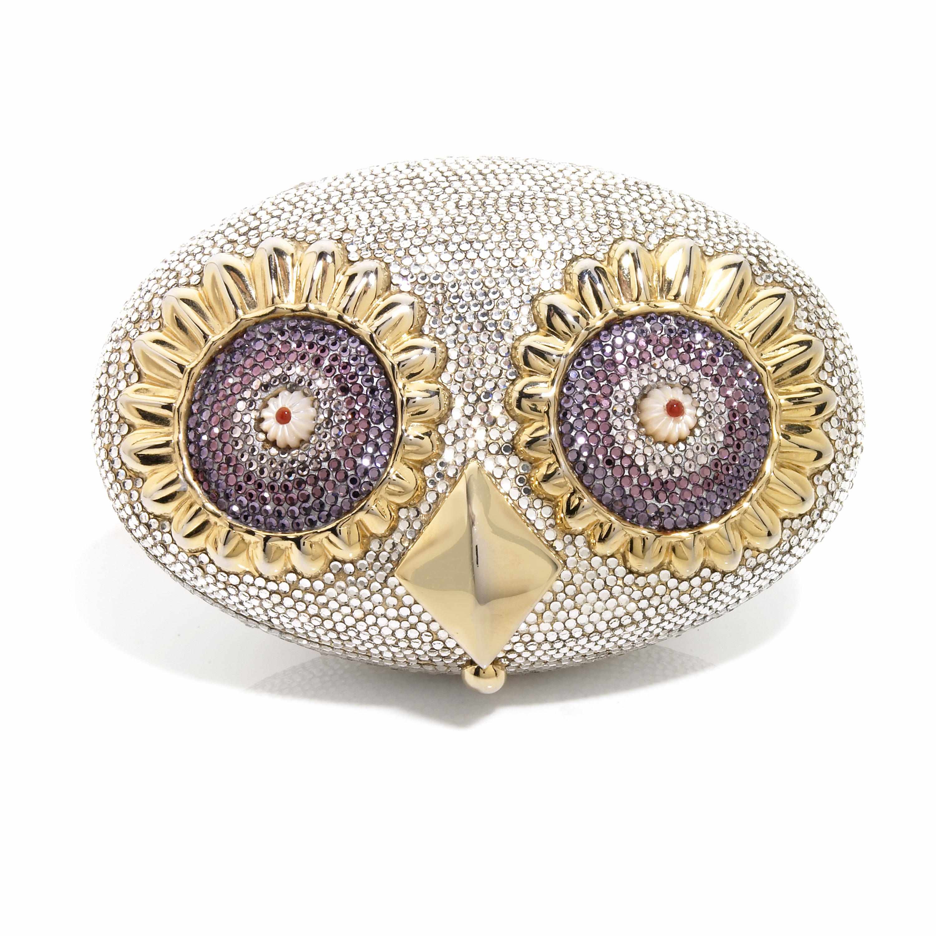 Appraisal: A silver crystal owl minaudiere with purple crystal eyes and