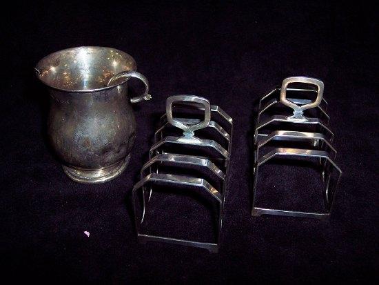 Appraisal: A pair of five bar toast racks Birmingham a silver