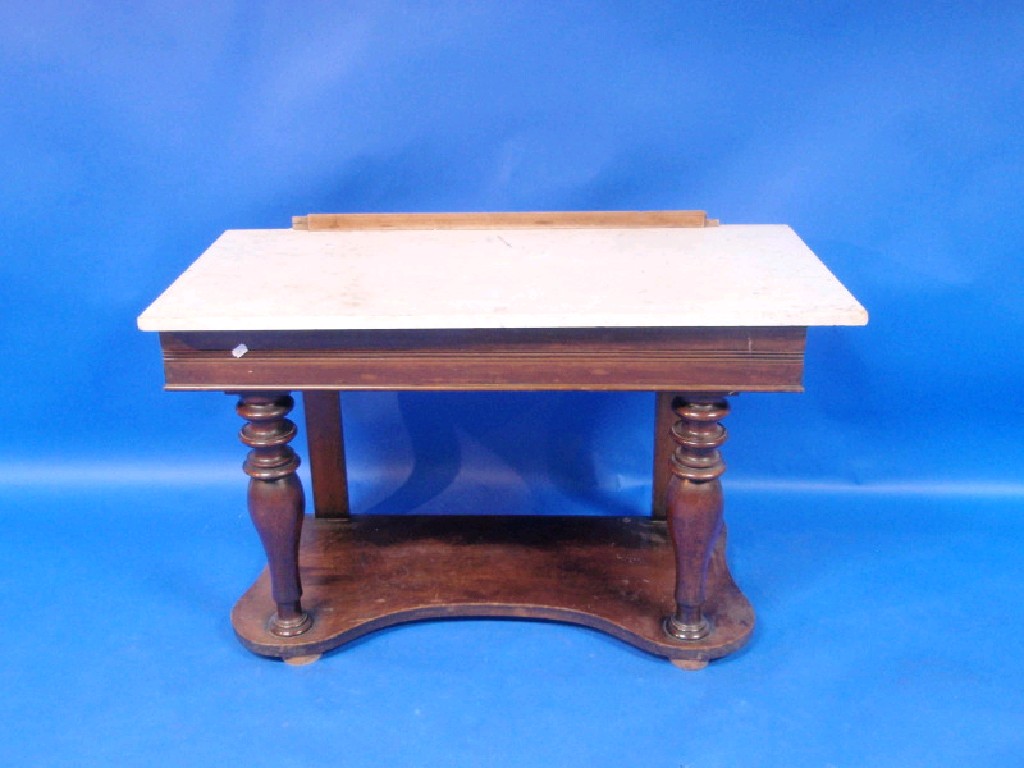 Appraisal: Victorian mahogany wash stand with white marble top the base