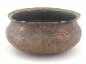 Appraisal: A large heavy copper bowl with folded rim signed with