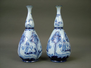 Appraisal: A pair of 'Florianware' bottle vases by William Moorcroft for