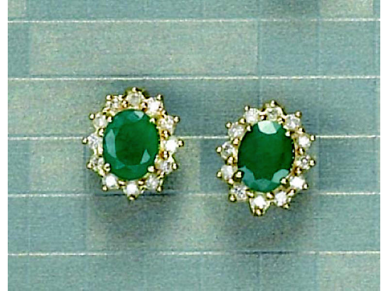 Appraisal: EMERALD AND DIAMOND EARRINGS k yellow gold oval pierced earrings