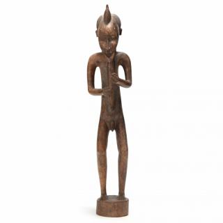 Appraisal: African Depiction of a Flute Player single piece wooden carving