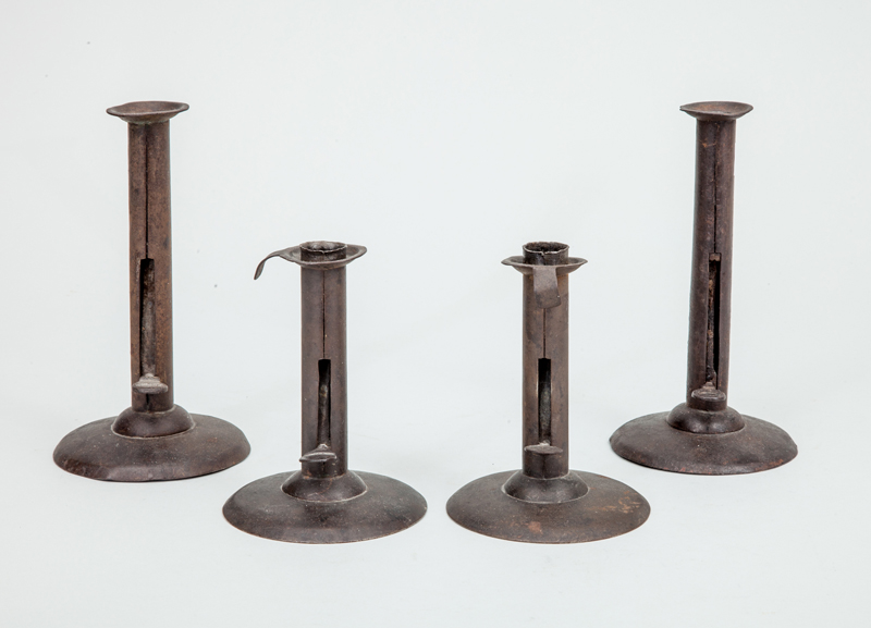 Appraisal: TWO ASSEMBLED PAIRS OF TIN CANDLESTICKS With ejector levers and