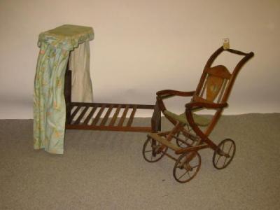 Appraisal: An early th century doll's folding push chair beech construction