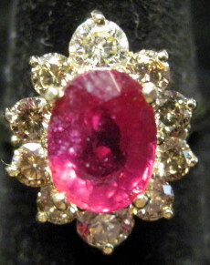 Appraisal: karat yellow gold ruby and diamond ringNavette form Oval ruby