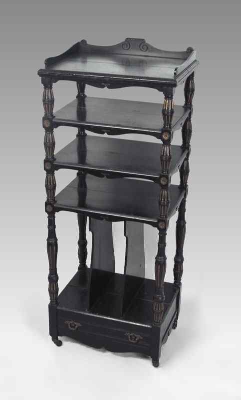 Appraisal: VICTORIAN MUSIC STAND Ebony finish carved gallery over shelves over