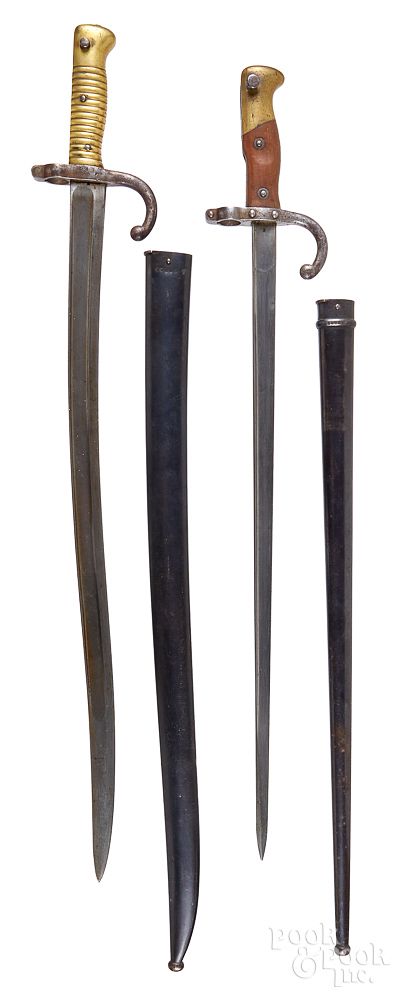 Appraisal: Two French sword bayonets with scabbards Two French sword bayonets