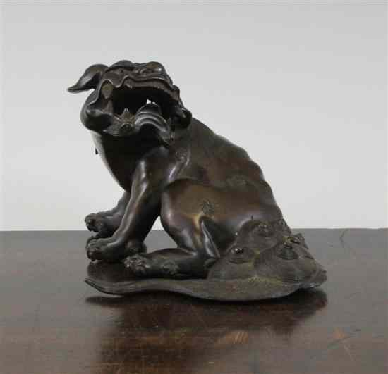 Appraisal: A Japanese bronze shi-shi incense burner the beast modelled in