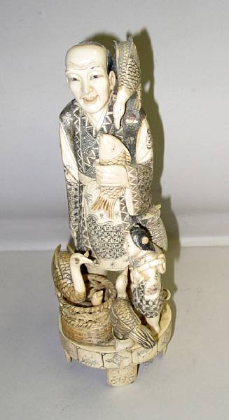 Appraisal: A Japanese style pieced ivory okimono of a cormorant fisherman