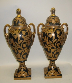 Appraisal: PAIR OF GOLD DECORATED PORCELAIN URNS gold floral and foliage