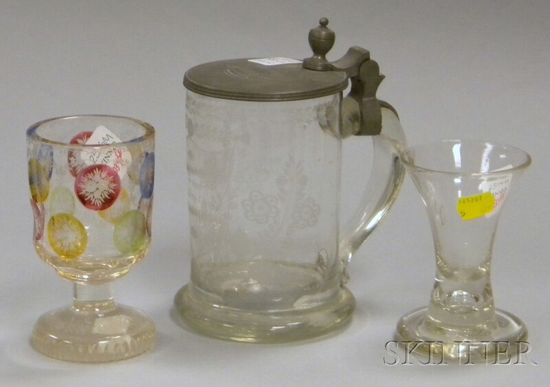 Appraisal: Three Colorless Glass Items a Bohemian etched and stained goblet