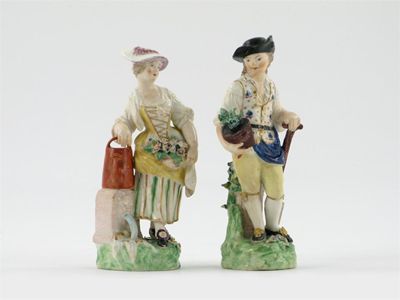 Appraisal: A near pair of Derby figures of gardeners he holding