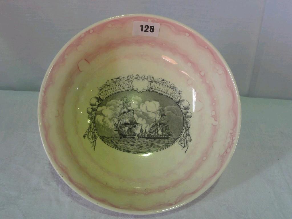 Appraisal: A bowl with pink lustre style finish and black and