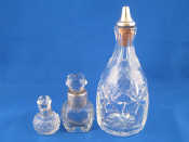 Appraisal: Three silver mounted cut glass perfume bottles one with sprinkler