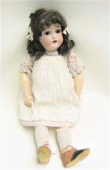 Appraisal: GERMAN KAMMER REINHARDT BISQUE SOCKET HEAD DOLL having brown wig