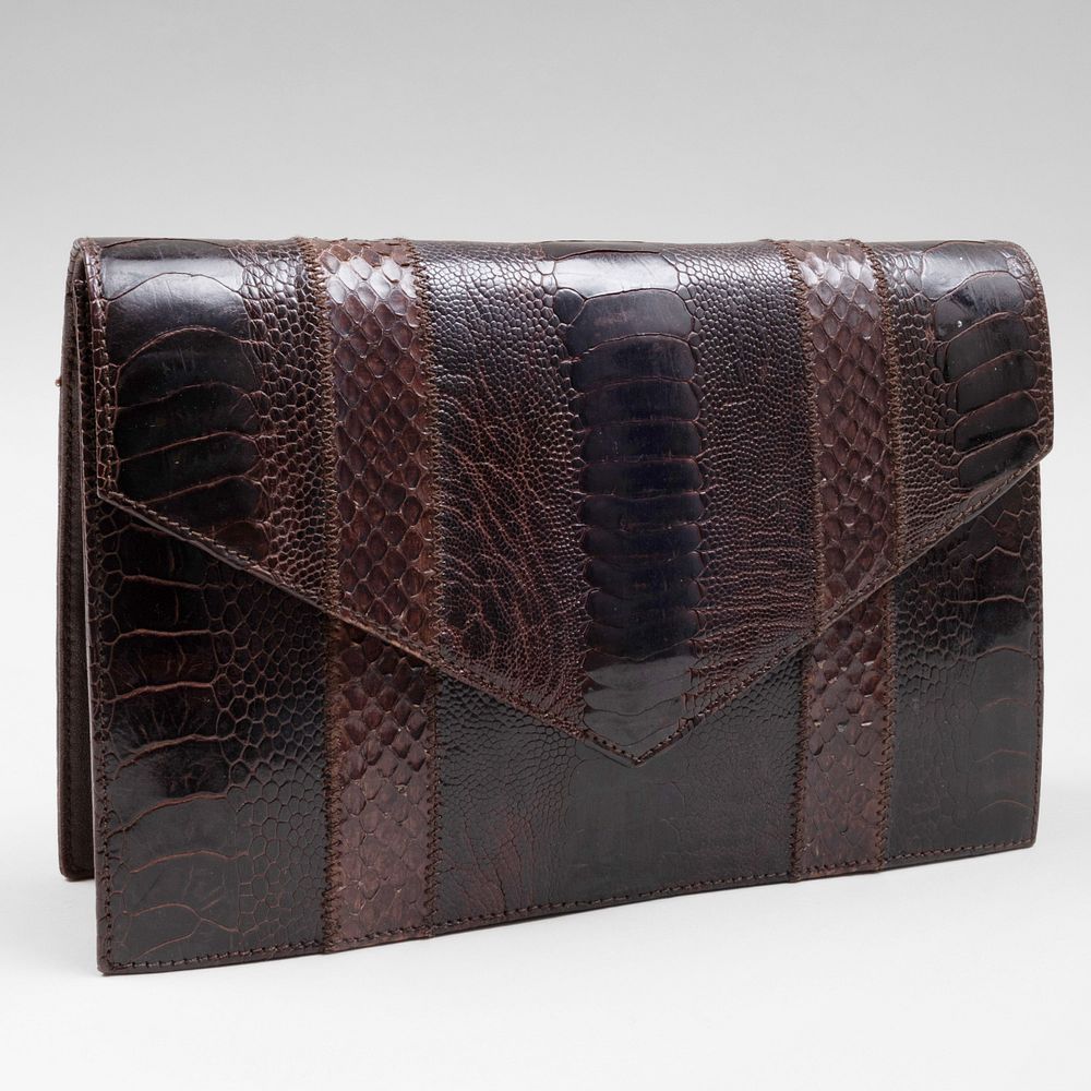 Appraisal: Yves Saint Laurent Haute Couture Brown Textured Leather Clutch Gilt