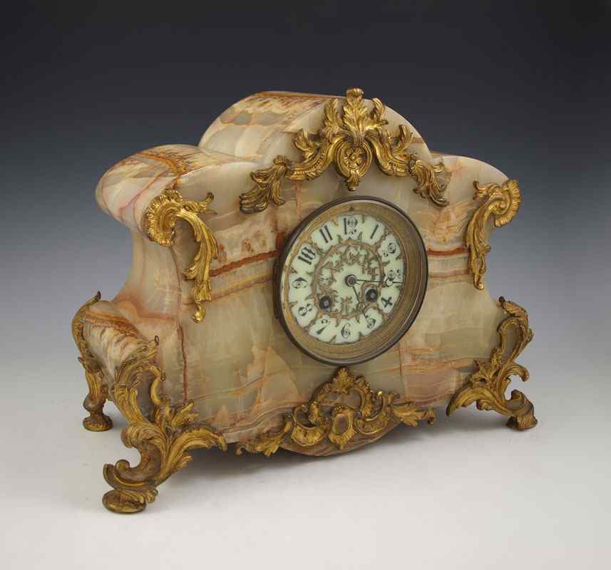 Appraisal: FRENCH MARBLE ORMOLU MANTLE CLOCK Variegated marble case with cast