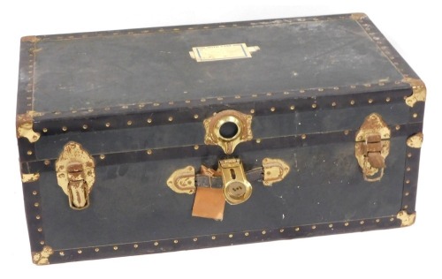 Appraisal: A blue bound canvas trunk with brass buckled corners and