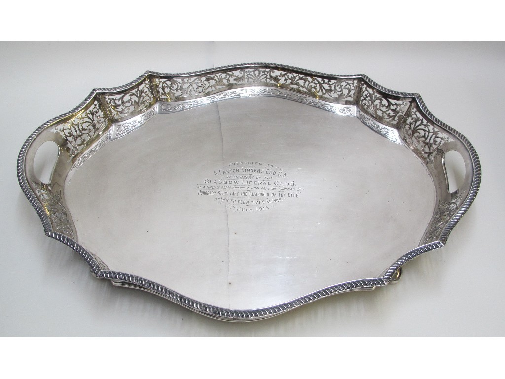 Appraisal: An Edwardian silver two handled tea tray with pierced border