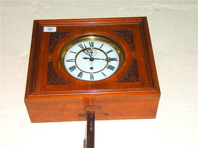 Appraisal: A German walnut cased wall clock the rectangular case enclosing