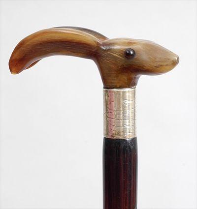 Appraisal: BAMBOO CANE WITH CARVED HORN RABBIT HEAD HANDLE The head