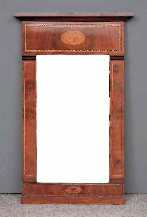 Appraisal: A th Century figured mahogany pier glass with angled cresting