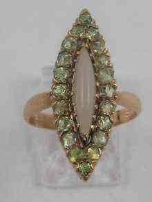 Appraisal: A Russian marquise shaped opal and demantoid garnet ring set