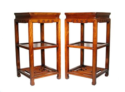 Appraisal: A pair of Chinese cyprus wood plant stands the aprons