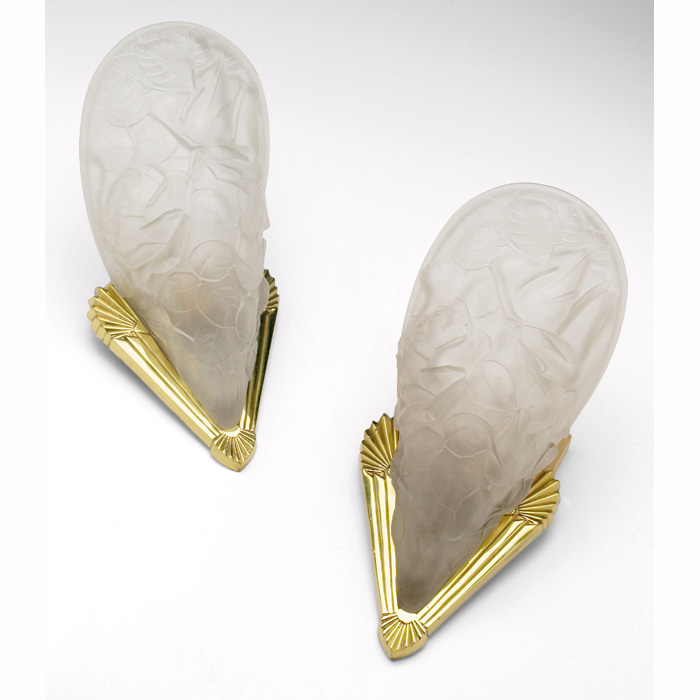 Appraisal: Art Deco sconces in frosted glass with hand carved brass