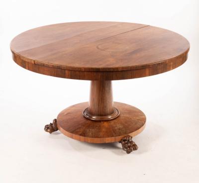 Appraisal: A Regency style rosewood circular breakfast table on a turned