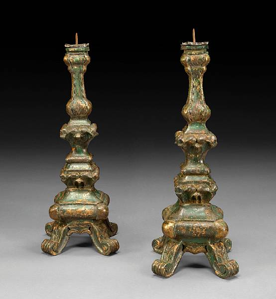 Appraisal: A pair of Baroque style paint decorated prickets Each knopped