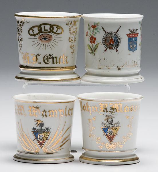 Appraisal: FOUR FRATERNAL SHAVING MUGS porcelain with polychrome painted fraternal symbols