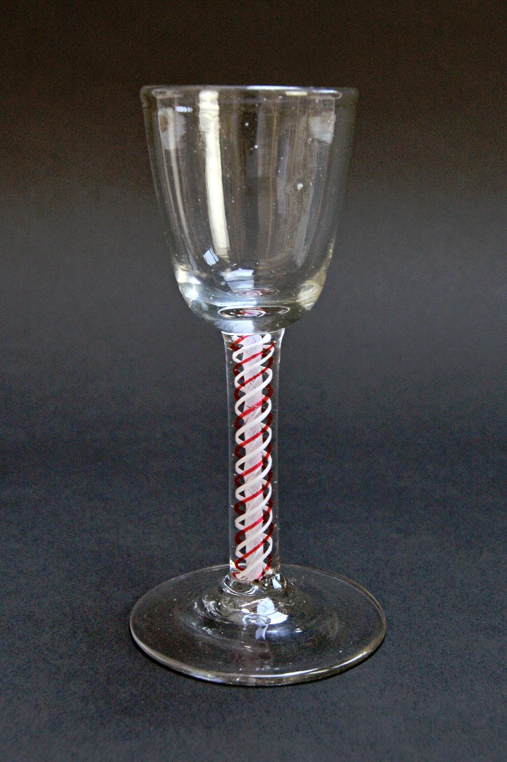 Appraisal: A colour twist wine glass probably early th century with