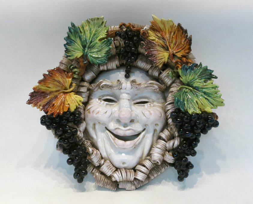 Appraisal: ITALIAN BACCHUS MASK WALL PLAQUE the jovial facemask bordered by