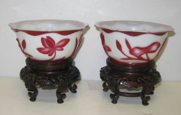 Appraisal: PAIR OF CHINESE RED OVERLAY BOWLS Carved to the opaque