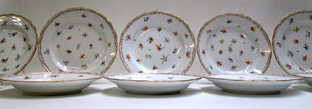 Appraisal: ELEVEN MEISSEN DINNER PLATES having scattered flowers and gilt scalloped