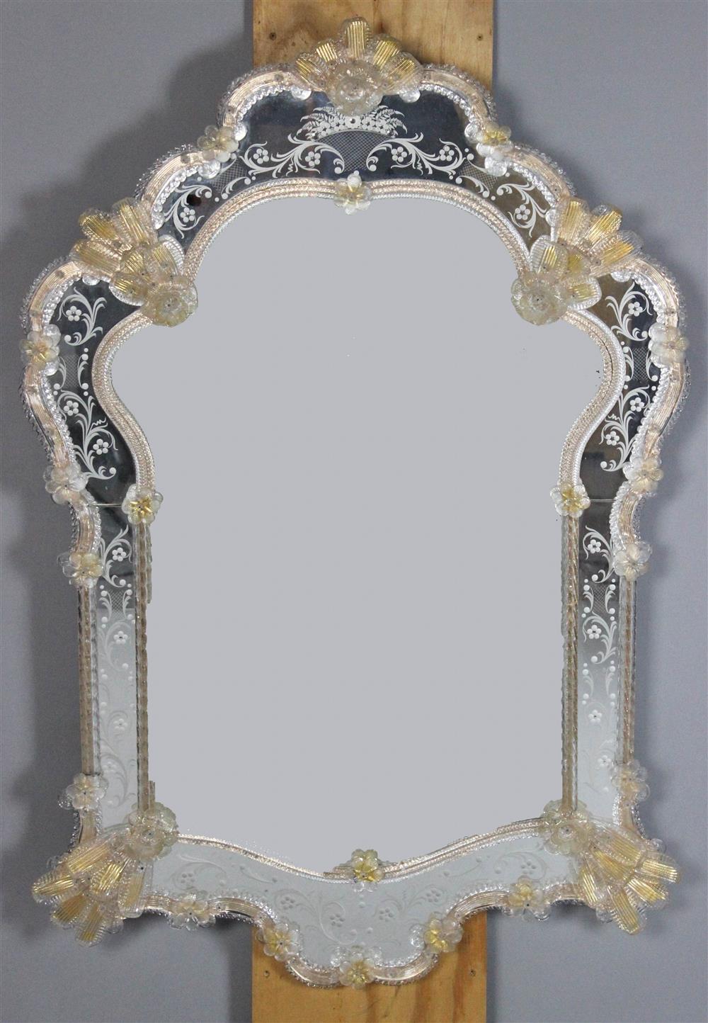 Appraisal: VENETIAN STYLE MIRROR shaped frame with applied glass flowers leaves