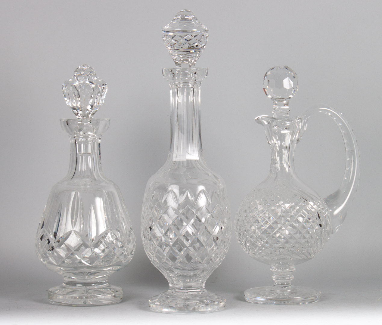 Appraisal: Two Waterford crystal decanters claret jug to in H