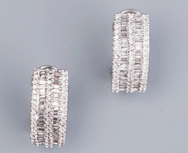 Appraisal: A PAIR OF DIAMOND HALF HOOP EARRINGS each channel set