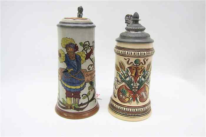 Appraisal: TWO GERMAN ETCHED BEER STEINS one with etched lid and