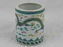 Appraisal: A Chinese cylindrical vase with green dragon amidst clouds underglaze