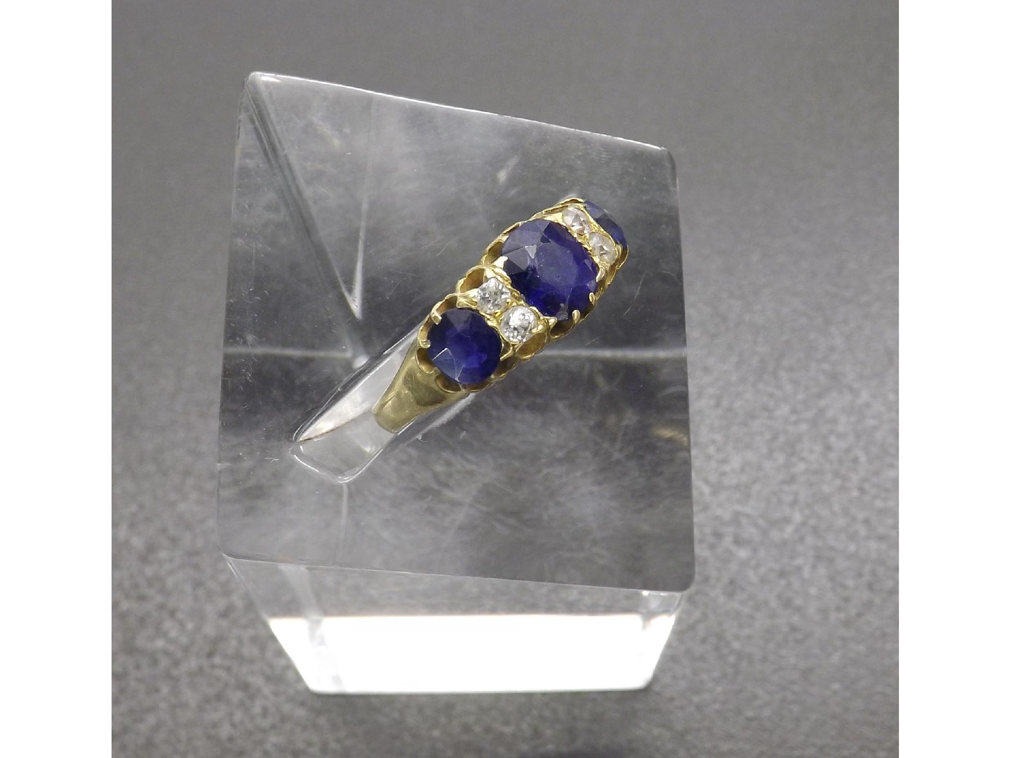 Appraisal: ct yellow gold claw set sapphire and diamond ring with