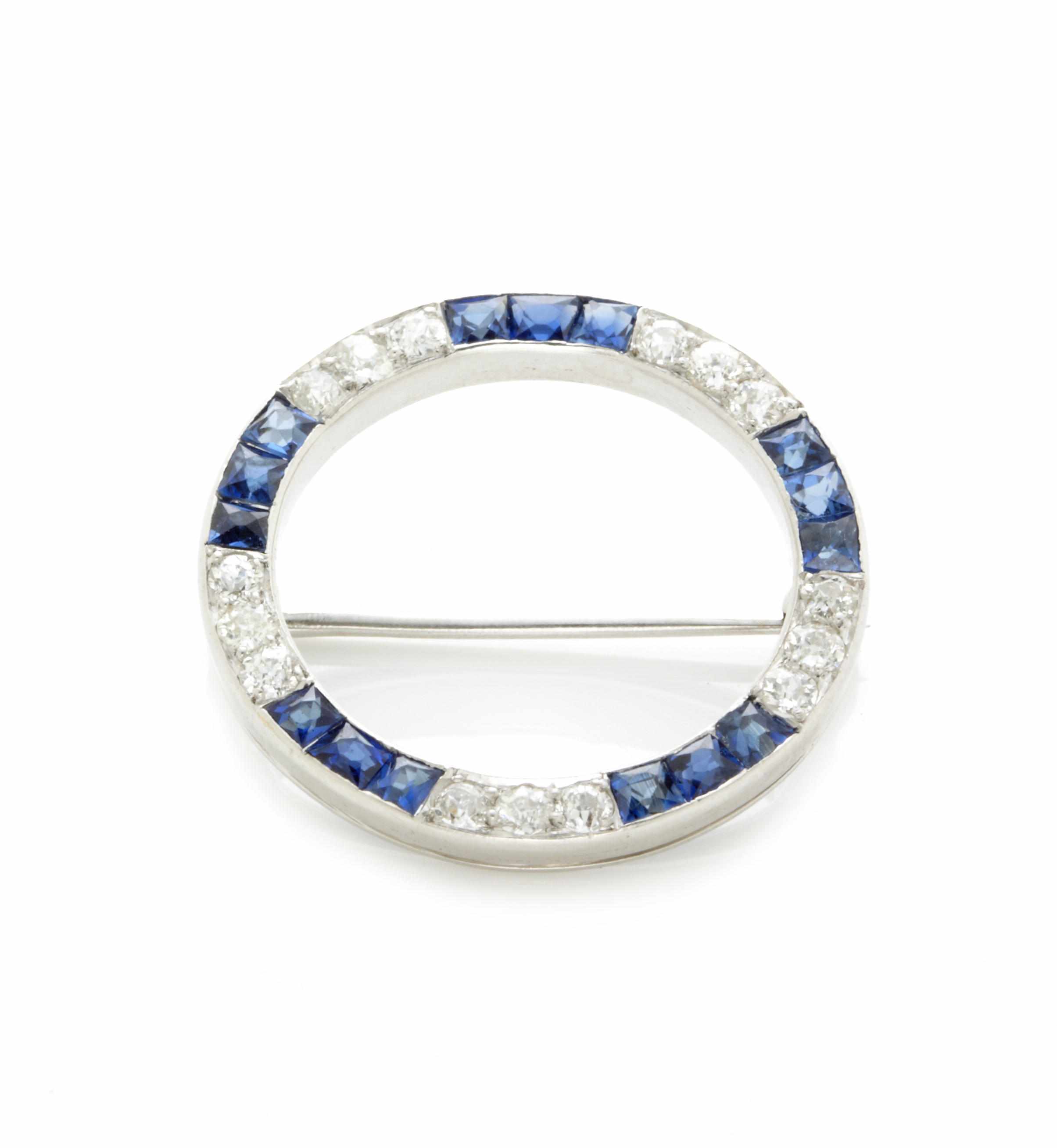 Appraisal: A diamond sapphire and white gold circle brooch diameter in