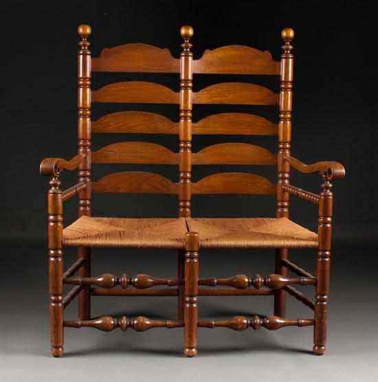 Appraisal: Wallace Nutting Colonial Revival walnut double chair-back rush-seat settee early