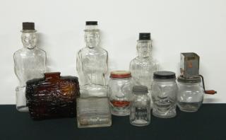 Appraisal: Figural banks Figural banks together with a figural jar and