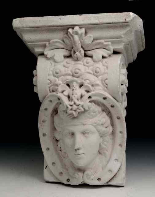 Appraisal: AN OLD PLASTER ARCHITECTURAL BRACKET with female mask decoration high