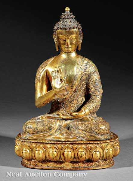 Appraisal: A Tibetan Gilt Bronze Figure of Buddha modeled seated upon