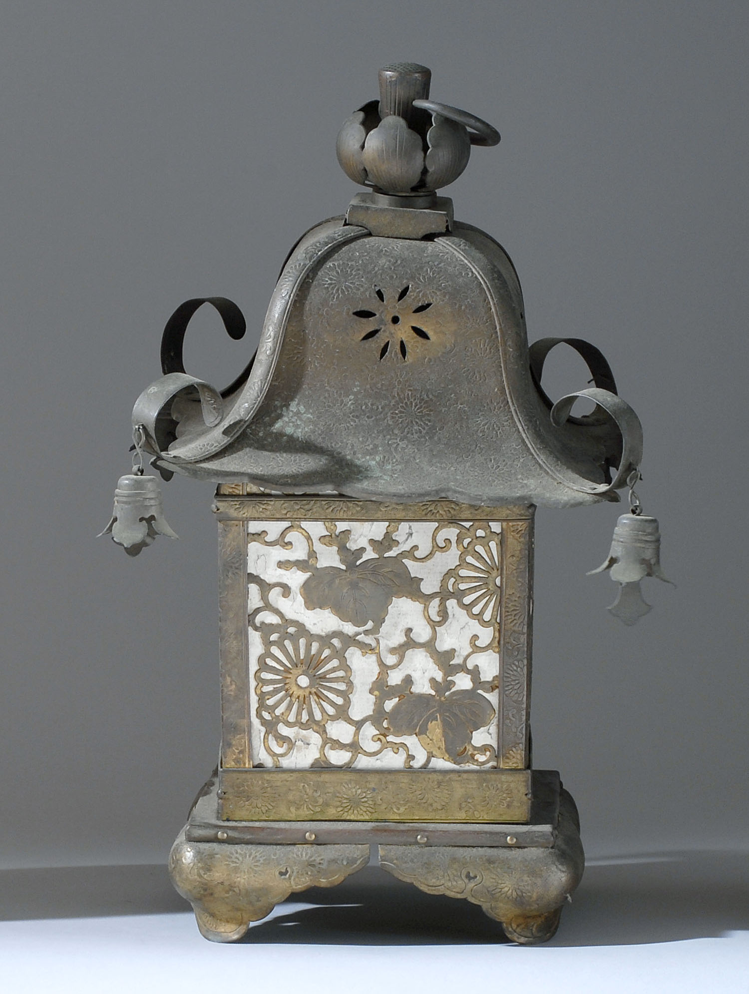 Appraisal: BRASS LANTERN th CenturyIn paulownia and chrysanthemum design Shaped feet